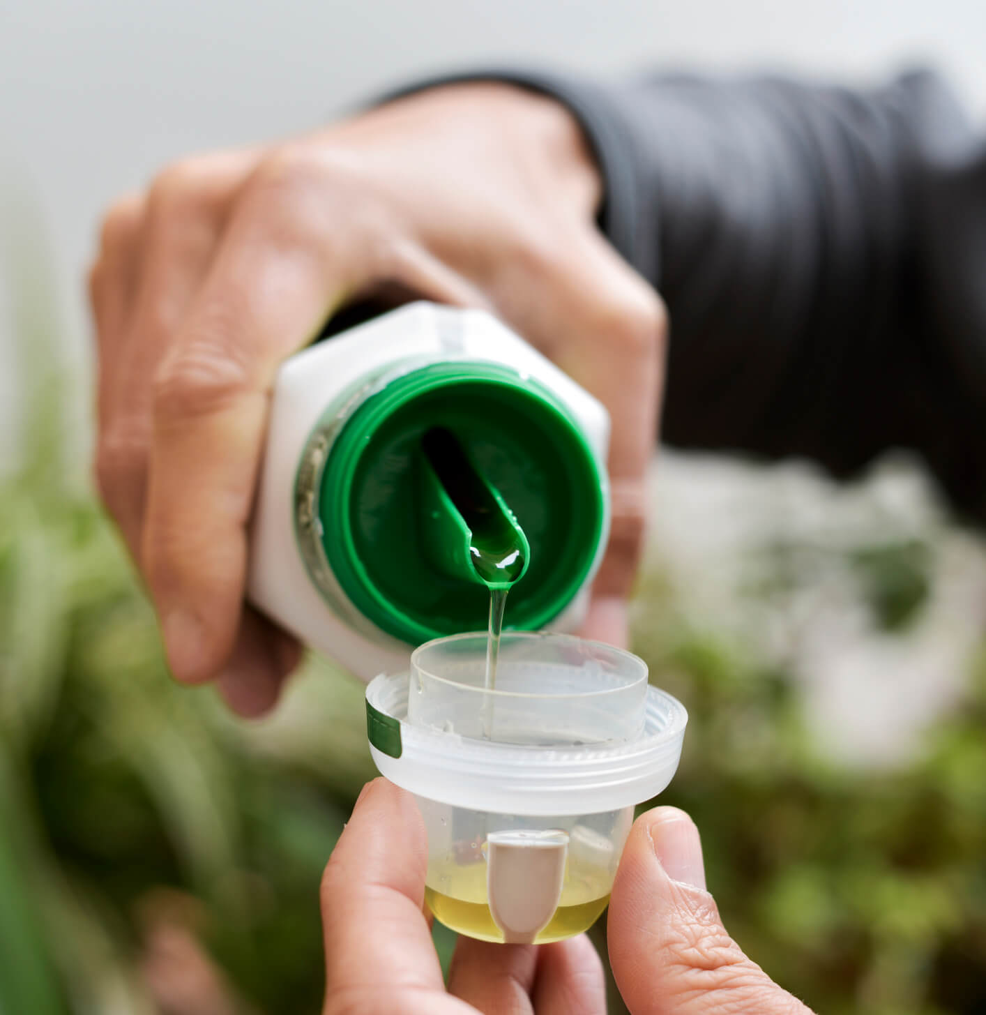 true-north-foliar-home-2 measuring a dose of liquid fertilizer